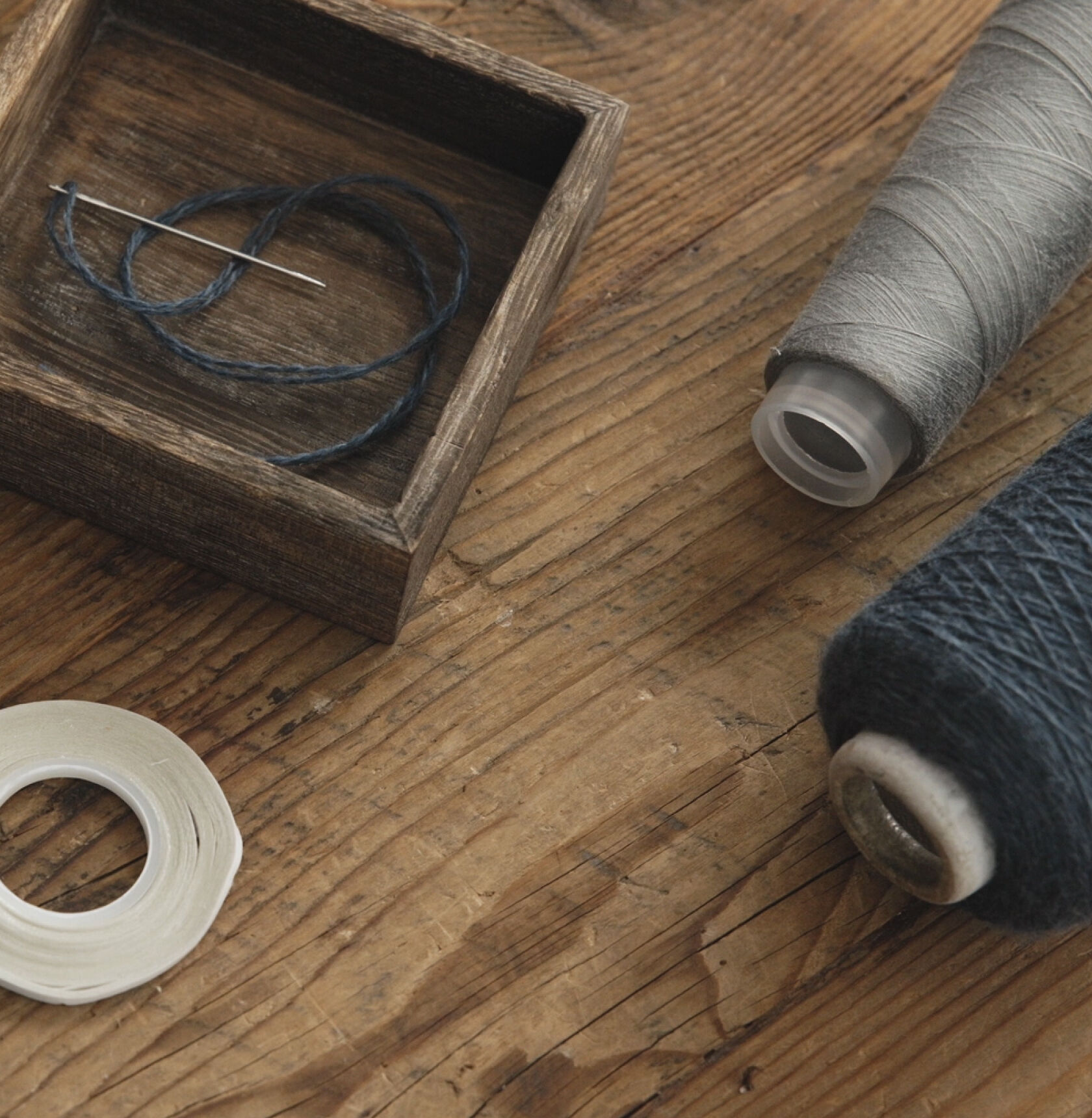 Gray and blue spools of thread.