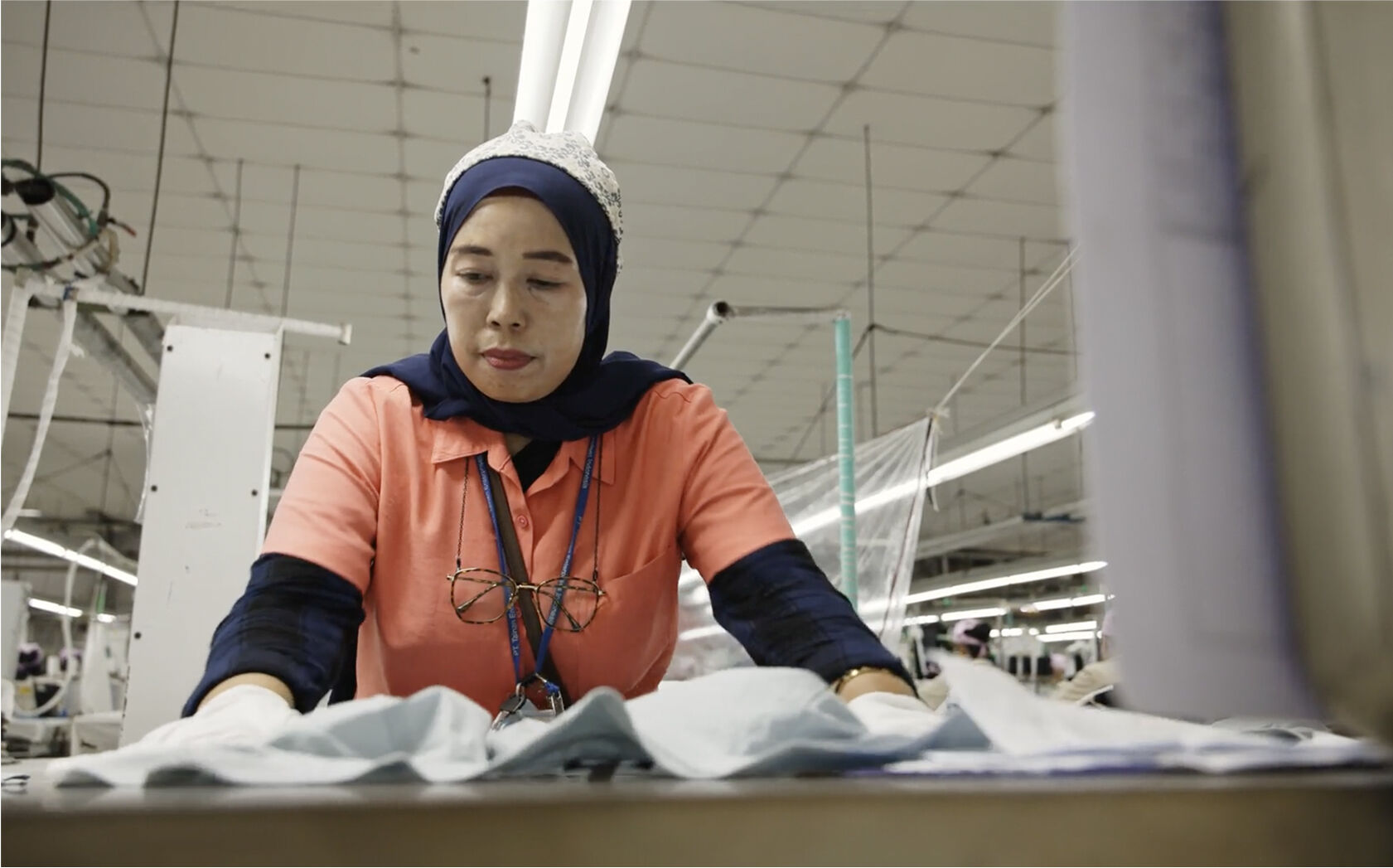 man holding fleece from sheep
