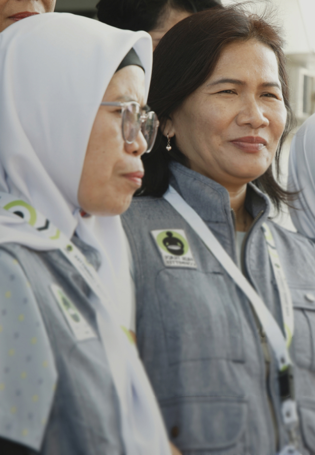A group of workers at PT Tainan wearing vests embroidered with the Fair Trade Certified logo.